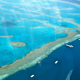A view of the Great Barrier Reef from a helicopter ride. The reef is responsible for an estimated 64,000 tourism jobs, according to a new Deloitte report. (Image: Sarah Ackerman/Flickr)